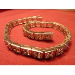 A large and heave 18 carat gold sapphire set Bracelet