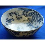An 18th Century Delft ware Bowl hand decorated in cobalt blue with various flower heads and leaves