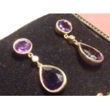 A pair of heavy 14 carat gold amethyst and diamond Earrings