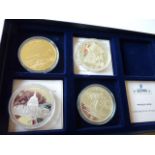 Four boxed silver gilt Medals commemorating Concorde, the London Blitz,