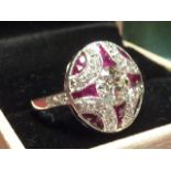 An 18 carat white gold ladies Ring the centre stone 1 carat diamond surrounded by rubies and