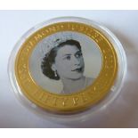 A commemorative silver gilt 50 Pence piece,