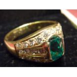 A superb 18 carat gold large fine emerald and diamond Ring