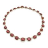 A XIXth century garnet, natural pearl and gold set.