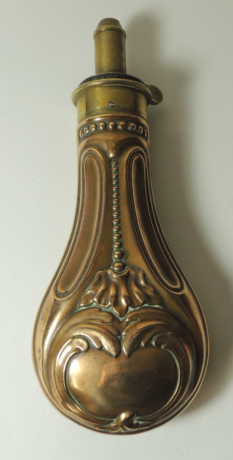 A 19th Century copper and brass powder flask with graduated nozzle, 20.5cms long ++good condition