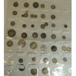 A collection of silver and part silver UK and foreign coins including USA Dollar 1921; George V