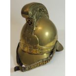 A Rider & Bell "Merryweather" brass firemans helmet for the Metropolitan Fire Brigade with lining