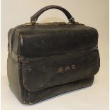 A late 19th/early 20th Century black leather Gladstone bag with side compartment, initialled in gold