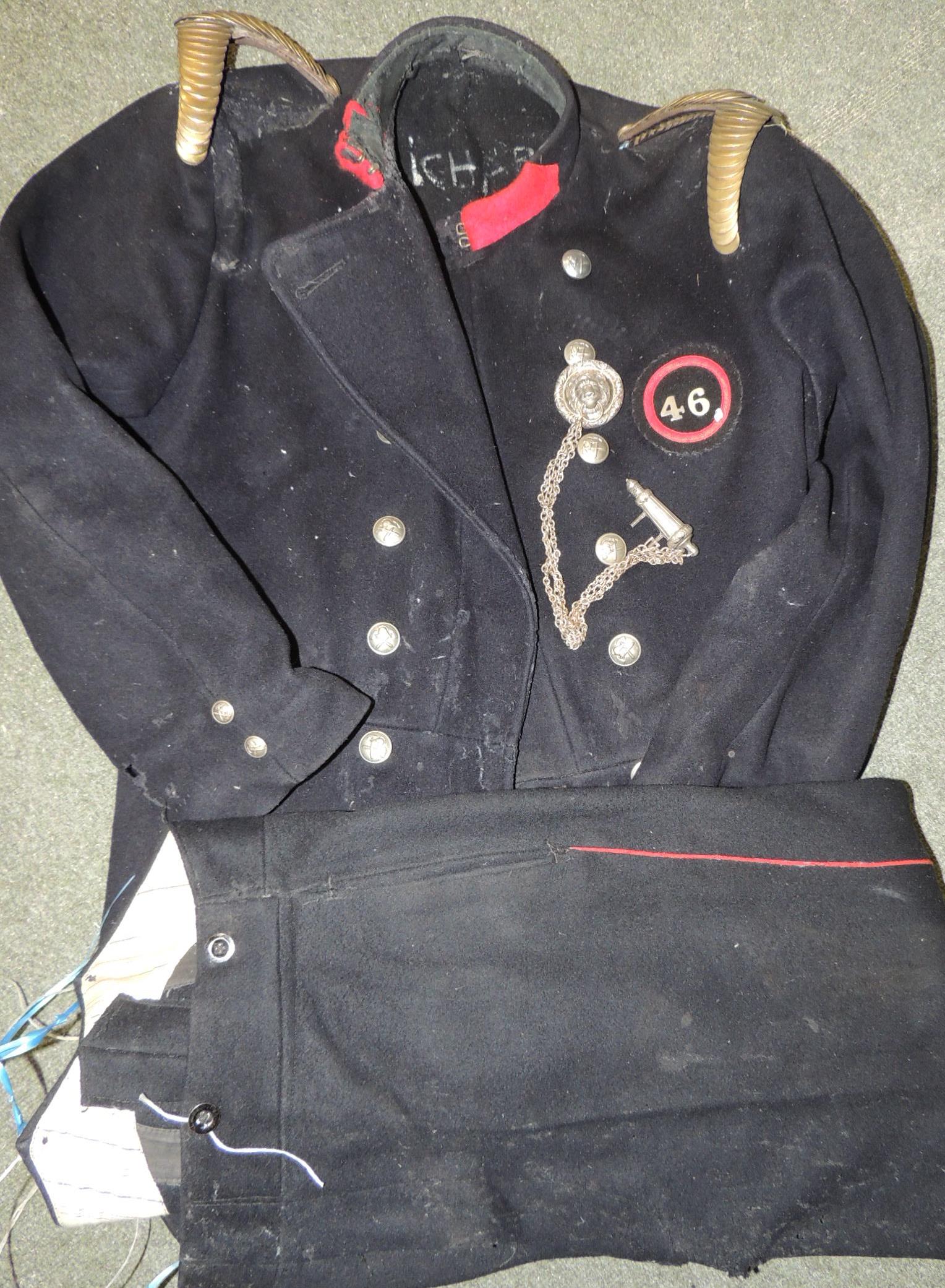 An early 20th Century Firemans tunic and trousers, the tunic labelled for Greater London Council and