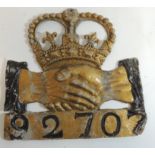 A lead fire mark of crowned cross hands "Hand in Hand Insurance Co" numbered "92707", 19.5cms high