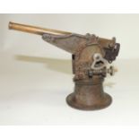 A Marklin model firing naval gun, cast metal with brass barrel, the barrel with makers mark,