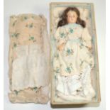 An early 20th Century doll with composition head and shoulders marked 24.A, painted features,