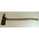 A fireman's axe with long wood shaft, overall length 83cms - one of five from the film set of The