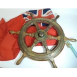 An early 20th Century six spoked wood and brass wheel from a canal boat, 42cms diam not including