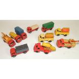 Ten assorted small friction driven lorries, moulded plastic, some with tinplate backs, English