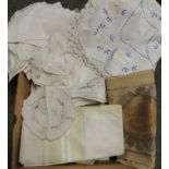 A quantity of early 20th Century table cloths, dressing table mats, runners; some with coloured