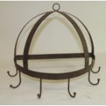 A metal game hanger of semi circular form with six hooks, 31cms high max