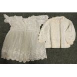 An Edwardian childs white fine cotton dress with self embroidered decoration together with a child's