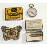 A late 19th/early 20th Century tin shaped as a butterfly with coloured litho detail, contains some