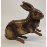 An early 20th Century tinplate clockwork toy "jumping" rabbit with printed litho detail, 12.5cms