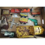 A clockwork tinplate train and goods wagons; a large cast metal Buddy Toys lorry; a tinplate