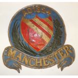 A 19th Century embossed tin fire mark "Manchester AD 1824" painted, 24cms high