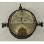 A Milli-Amps dial no.74468, in heavy lacquered brass casing and with silvered metal dial 6.5cms