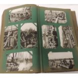 A large early 20th Century album of approx 390 photo topo postcards, GB and foreign including many