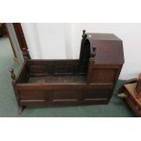 A late 18th/early 19th Century oak, panelled child's cradle. Turned finials and with later rockers