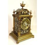 A decorative Victorian mantel clock in enamelled brass case, having two train movement hour and half
