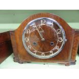 An early 20th Century walnut cased mantel clock