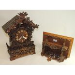 An impressive large 19th Century Black Forest cuckoo clock, the bracket clock with "tiled" roof,