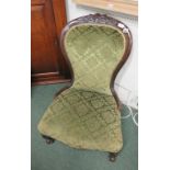 A late Victorian beech framed ladies upholstered chair on short cabriole legs and with ball feet.