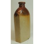 A 19th Century stoneware gin flask impressed "Stich Wine and Spirit Merchant Duke of Wellington