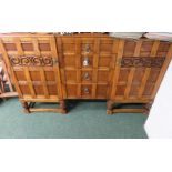 A 20th Century sideboard fitted four central drawers, cupboard to either end and on short turned