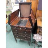 A Georgian mahogany companion washstand on tapering legs with brass castors and side carrying