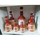 Seven Wade Bells whisky "bell" bottles (7)