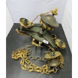 A decorative bronzed and gilt metal three branch pendant ceiling light fitting with suspension chain