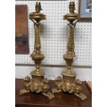 A pair of good quality cast brass table lamps on lion bases