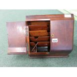 A late 19th/early 20th Century mahogany stationery box with pair of doors at the front