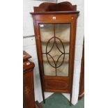 An Edwardian mahogany, inlaid corner display cabinet. Astragal glazed door enclosing three fitted