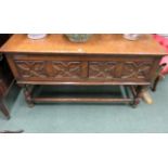 An 19th Century oak dresser, fitted two deep drawers above turned baluster and block legs, with