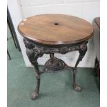 An iron based decorative pub table, the base cast with figural and foliate decoration