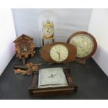 An anniversary timepiece under glass dome, a small cuckoo clock, two mantel timepieces and an