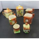 A group of Cottage ware items including jugs, preserve pot and egg cup