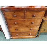 A Victorian, mahogany chest of two short and three long drawers, bun handles and on plinth base