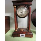 A small late 19th Century portico mantel timepiece