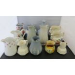 A quantity of decorative jugs including a late 19th Century Jasper ware type and other moulded