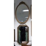 A brass framed mirror and an oval gilt framed mirror (2)