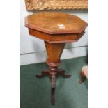 A Victorian, walnut octagonal, pedestal work table, the burr walnut top opening to reveal a fitted